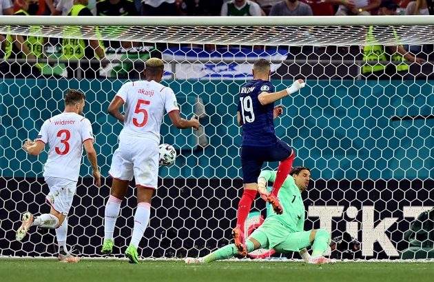 French scorer Karim Benzema (No. 19) scores a goal in the EURO round final against Switzerland. 