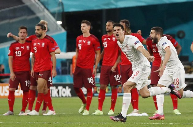 The Spaniards celebrate advancing to the EURO semifinals.  Footballers Gerard Moreno and Jordi Alba rejoice after winning a penalty shootout over Switzerland.