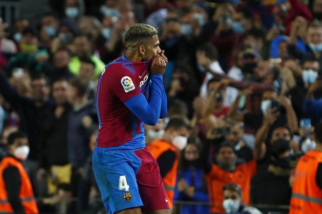 Barcelona's Ronald Araujo celebrates after scoring a goal in Granada's net in a Spanish league match.