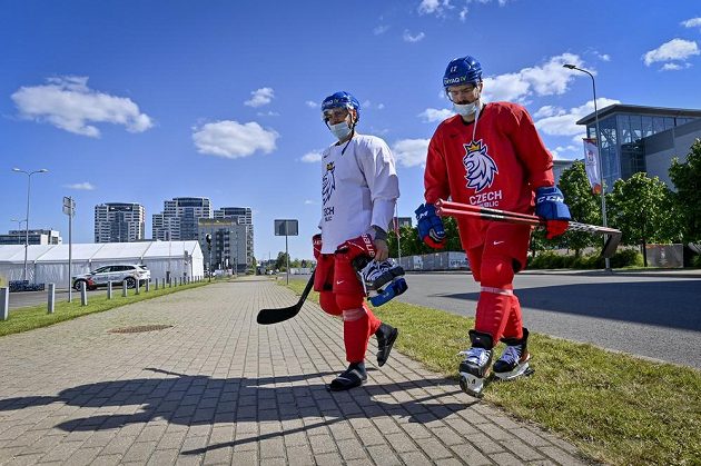 Forward Robin Hanzl (left) and defender Filip Hronek head to the Riga Arena for Wednesday morning practice.