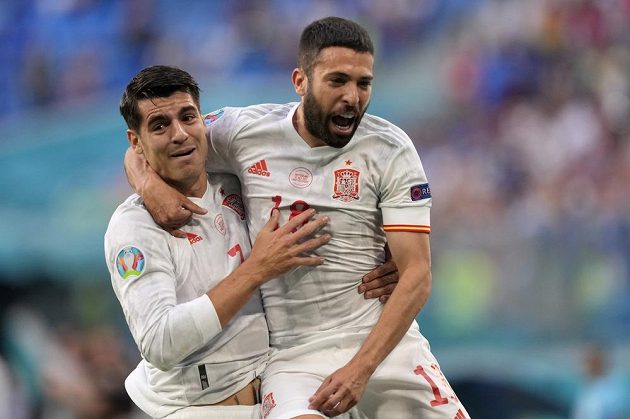 Spanish hero Jordi Alba celebrates a goal in the Swiss net in the EURO quarterfinals with teammate Alvar Morata.