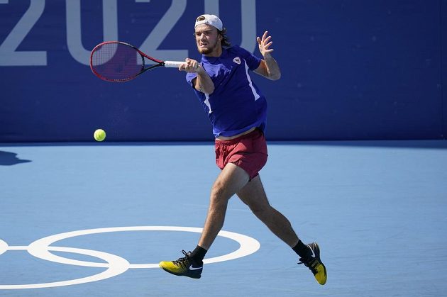 Tomas Machac, of the Czech Republic, returns to Diego Schwartzman, of Argentina, during second round of the men's tennis competition at the 2020 Summer Olympics, Tuesday, July 27, 2021, in Tokyo, Japan. (AP Photo/Patrick Semansky)