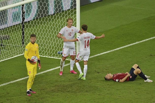 Danish football player Kasper Dolberg (middle) celebrates a goal in the Czech net with his teammate Mikkel Damsgaard during the EURO quarterfinals.