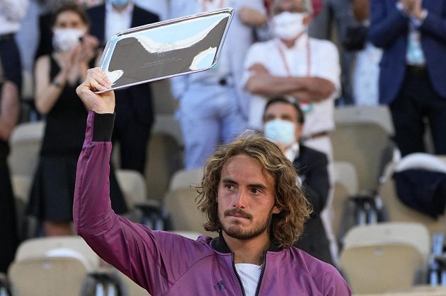 Greek tennis player Stefanos Tsitsipas with a trophy for the defeated French Open finalist.