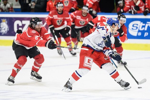 Martin Ulmer (left) from Austria and Czech forward Petr Kodýtek in action.