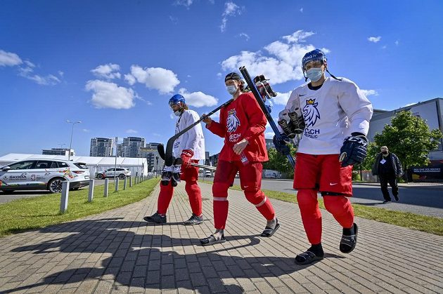 From left, defenders David Musil and Andrej Šustr and forward Adam Musil come to the Riga Arena in gear.