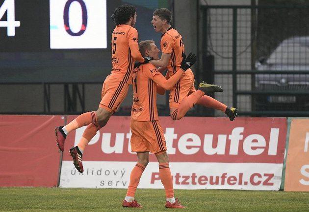 Mladá Boleslav footballers (from left) Alexej Tatajev, Michal Škoda and David Douděra rejoice at the goal.