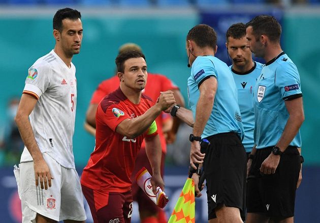 Swiss footballer Xherdan Shaqiri and Spaniard Sergio Busquets with referees leading the EURO quarterfinals.