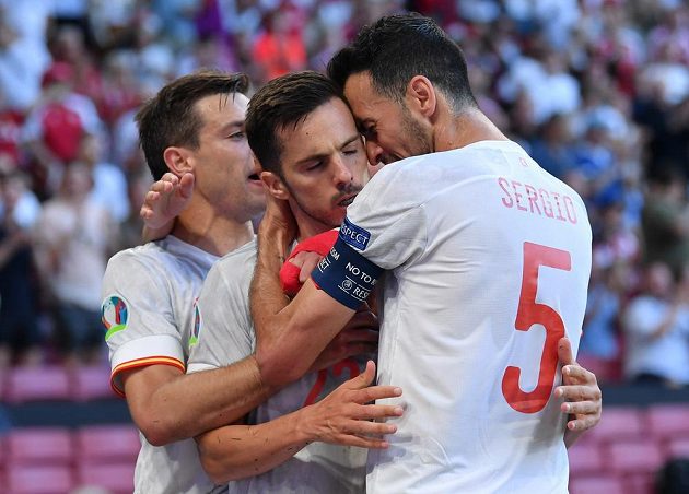 The scorer of the Spanish goal Pablo Sarabia (middle) receives congratulations from his teammates.