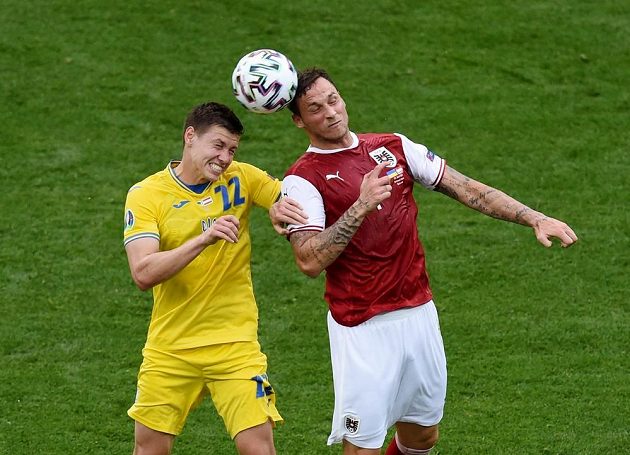 Austrian forward Marko Arnautovic (right) in a header duel with Mykola Matvijenko from Ukraine.