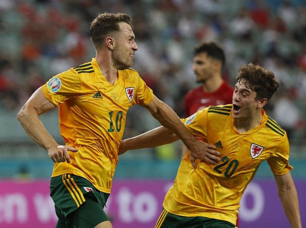 Welshman Aaron Ramsey (10) rejoices after opening the score against Turkey.  On the right, Daniel James.