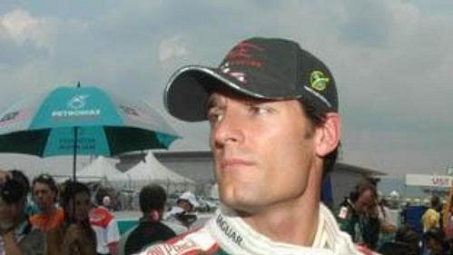 Pilot Jaguaru Mark Webber při Velké ceně Malajsie. Pilot Jaguaru Mark Webber při Velké ceně Malajsie.