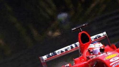 Rubens Barrichello s monopostem ferrari na trati GP v Monze. Rubens Barrichello s monopostem ferrari na trati GP v Monze.