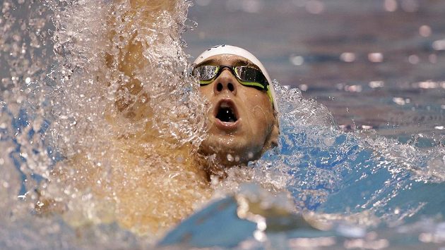 Americký plavec Michael Phelps během závodu na 100 m motýlek na americkém šampionátu ve Federal Way. Americký plavec Michael Phelps během závodu na 100 m motýlek na americkém šampionátu ve Federal Way.
