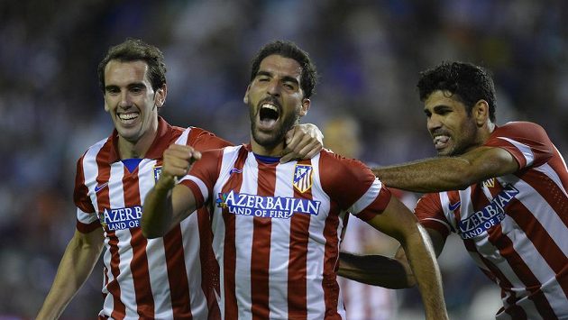 Raúl García z Atlétika Madrid (uprostřed) se raduje z gólu. Raúl García z Atlétika Madrid (uprostřed) se raduje z gólu.