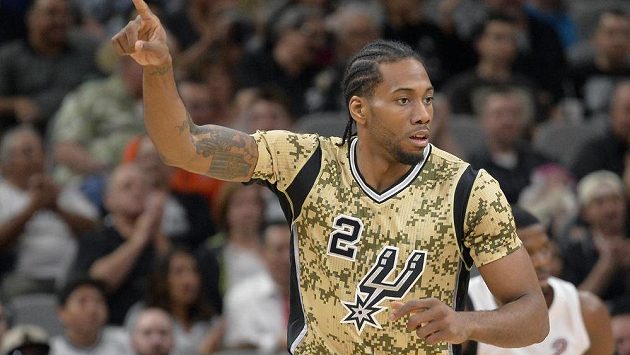 San Antonio Spurs forward Kawhi Leonard celebrates a 3-point basket during the first half of an NBA basketball game against the Miami Heat, Wednesday, March 23, 2016, in San Antonio. (AP Photo/Darren Abate) San Antonio Spurs forward Kawhi Leonard celebrates a 3-point basket during the first half of an NBA basketball game against the Miami Heat, Wednesday, March 23, 2016, in San Antonio. (AP Photo/Darren Abate)