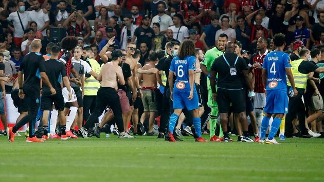 Wilderness in France!  A foul on the field was interrupted by fans of the team