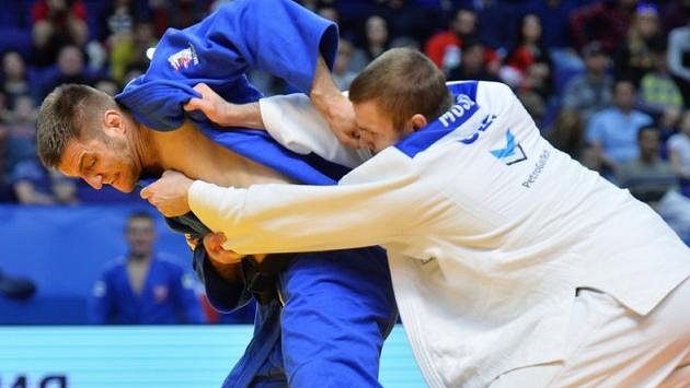 Jaromír Musil (v bílém) na svého soupeře nestačil (archivní foto) Jaromír Musil (v bílém) na svého soupeře nestačil (archivní foto)